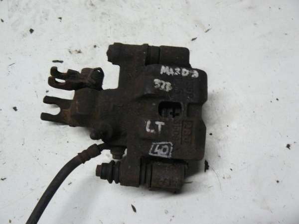 Mazda 323 1998 2003r Zacisk Hamulcowy Tylny Lewy